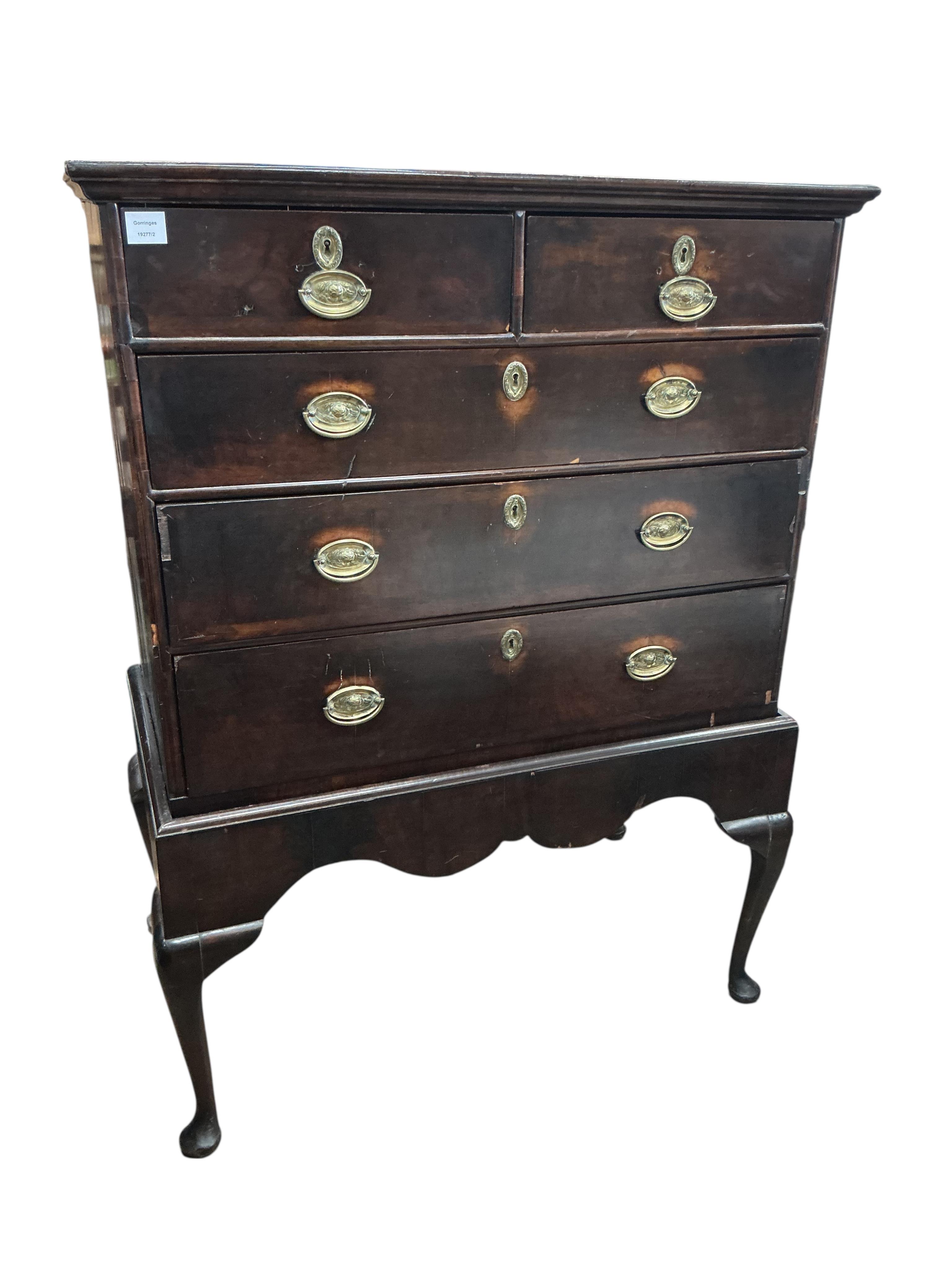 An 18th century banded walnut chest on stand, width 98cm, depth 54cm, height 131cm
